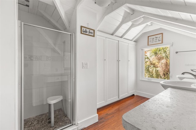 308 Chauncey Ave, Bradenton, FL 34208 - full bath featuring visible vents, a shower stall, vanity, wood finished floors, and lofted ceiling with beams