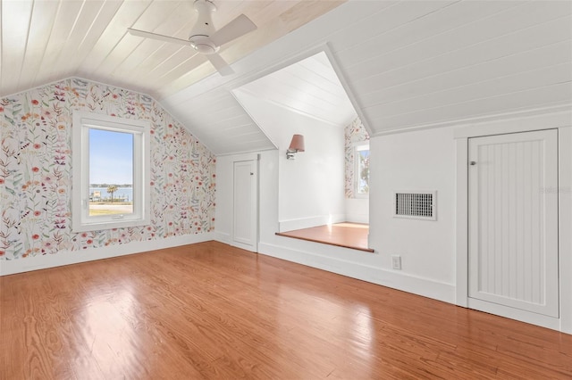 308 Chauncey Ave, Bradenton, FL 34208 - additional living space with visible vents, wallpapered walls, and wood finished floors