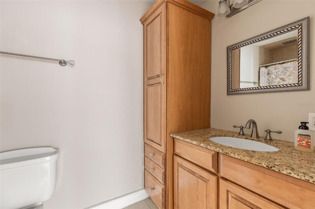 308 Chauncey Ave, Bradenton, FL 34208 - full bath featuring vanity, toilet, and tile patterned flooring