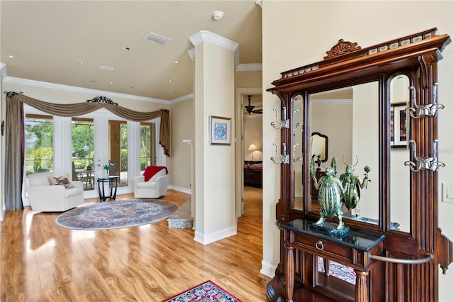 19815 Sea Rider Way, Lutz, FL 33559 - entrance foyer featuring crown molding, wood finished floors, and baseboards