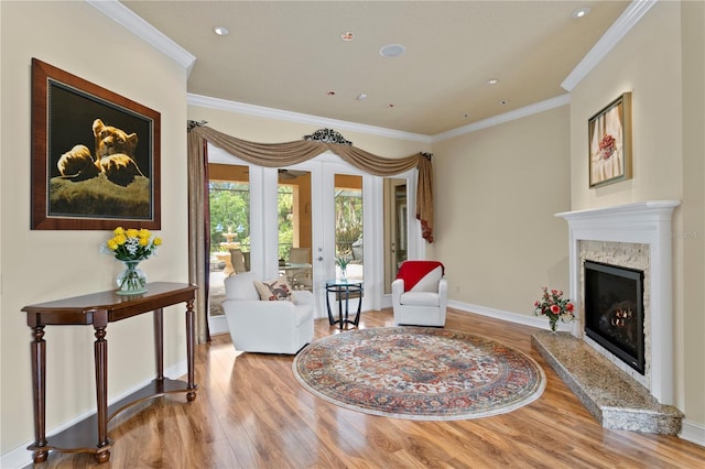 19815 Sea Rider Way, Lutz, FL 33559 - sitting room with wood finished floors, a fireplace, ornamental molding, baseboards, and recessed lighting