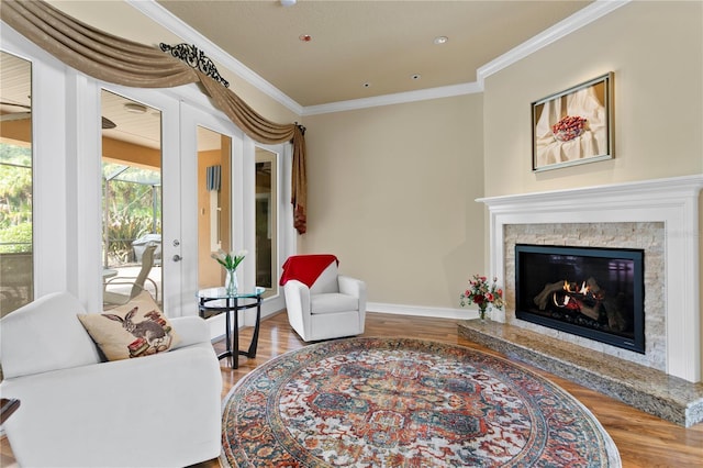 19815 Sea Rider Way, Lutz, FL 33559 - living room with wood finished floors, ornamental molding, baseboards, a fireplace, and french doors