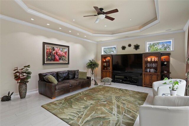 19815 Sea Rider Way, Lutz, FL 33559 - living room featuring a tray ceiling, a ceiling fan, baseboards, crown molding, and recessed lighting