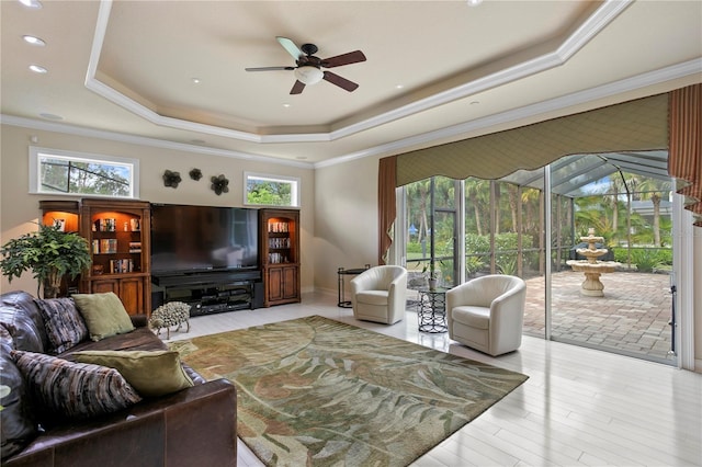 19815 Sea Rider Way, Lutz, FL 33559 - living area with a tray ceiling, a ceiling fan, ornamental molding, wood finished floors, and recessed lighting