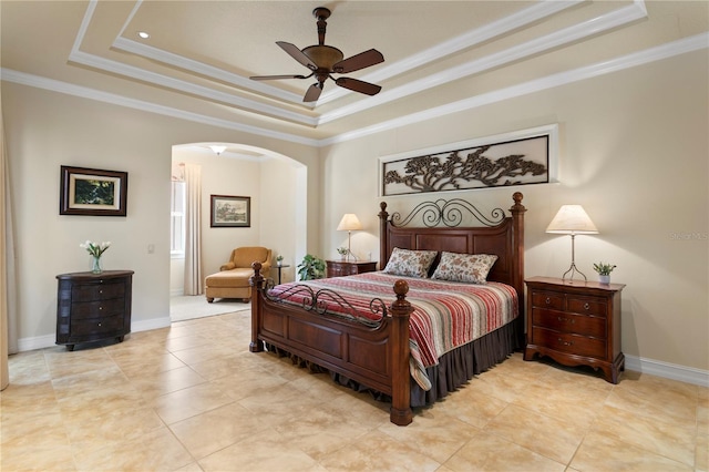 19815 Sea Rider Way, Lutz, FL 33559 - bedroom with a tray ceiling, arched walkways, crown molding, baseboards, and light tile patterned floors