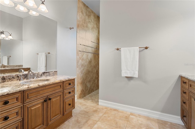 19815 Sea Rider Way, Lutz, FL 33559 - bathroom featuring vanity, a walk in shower, tile patterned flooring, and baseboards