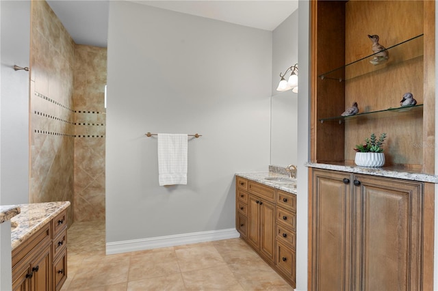 19815 Sea Rider Way, Lutz, FL 33559 - bathroom with baseboards, tile patterned floors, vanity, and a walk in shower
