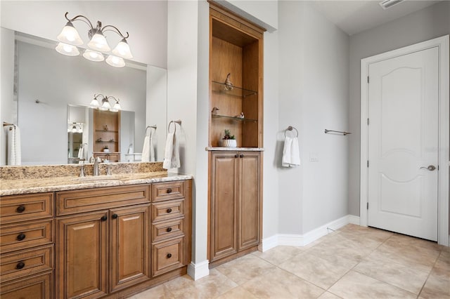 19815 Sea Rider Way, Lutz, FL 33559 - bathroom featuring vanity, tile patterned floors, baseboards, and a chandelier