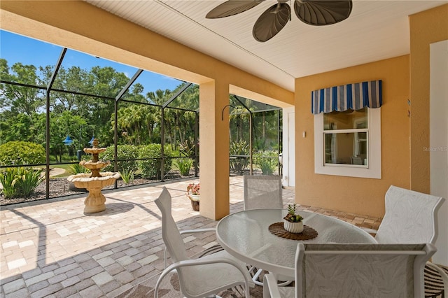 19815 Sea Rider Way, Lutz, FL 33559 - view of patio / terrace featuring outdoor dining area, glass enclosure, and a ceiling fan