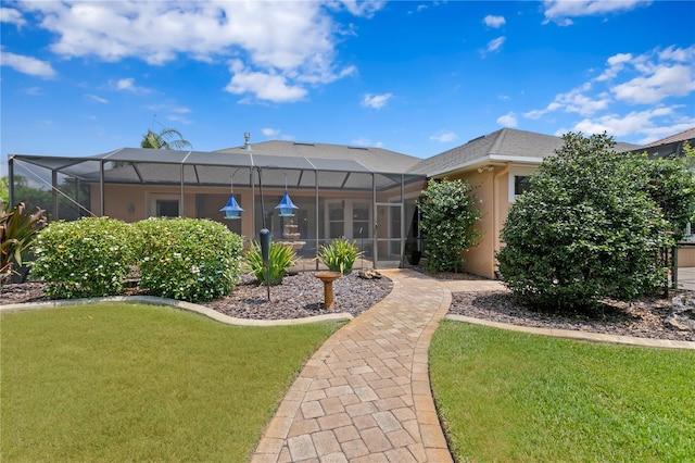 19815 Sea Rider Way, Lutz, FL 33559 - rear view of house featuring a lawn, stucco siding, and a lanai