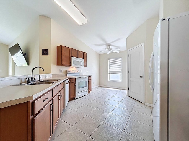 7504 Turtle View Dr, Ruskin, FL 33573 - kitchen featuring white appliances, ceiling fan, light countertops, light tile patterned flooring, and brown cabinets