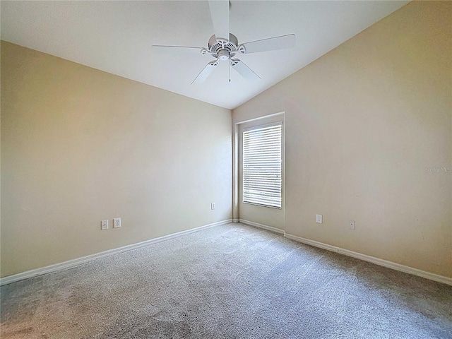 7504 Turtle View Dr, Ruskin, FL 33573 - empty room featuring carpet flooring, a ceiling fan, and vaulted ceiling