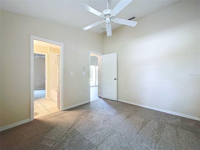 7504 Turtle View Dr, Ruskin, FL 33573 - unfurnished bedroom featuring carpet floors and a ceiling fan