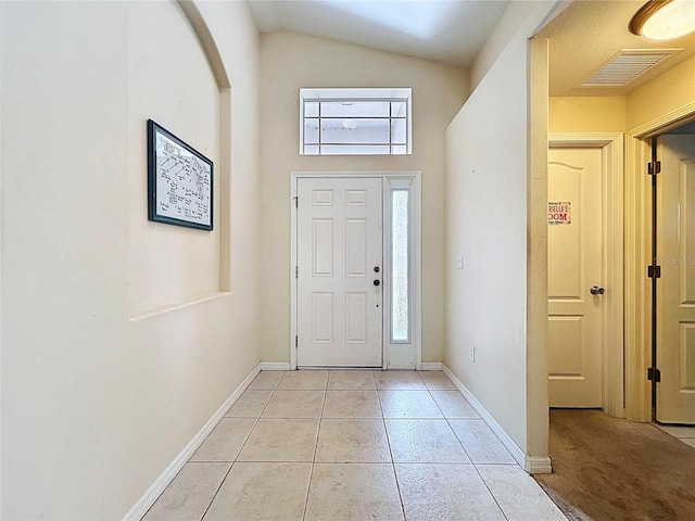 7504 Turtle View Dr, Ruskin, FL 33573 - foyer featuring healthy amount of natural light, light tile patterned floors, and lofted ceiling