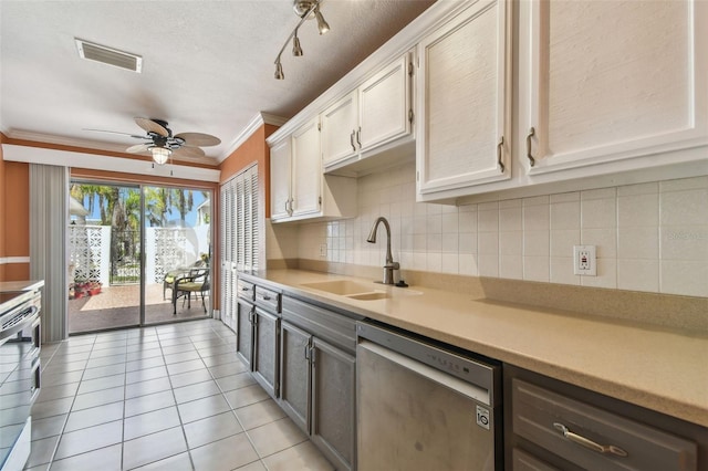 kitchen with appliances with stainless steel finishes, a sink, ornamental molding, backsplash, and ceiling fan