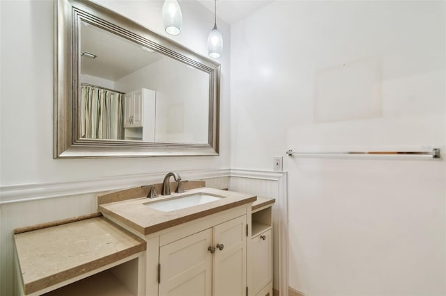 bathroom with wainscoting and vanity
