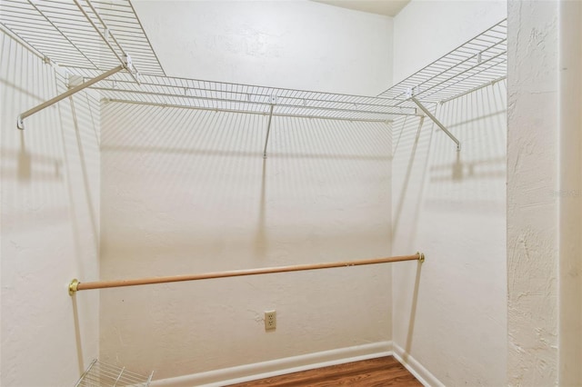 spacious closet with wood finished floors