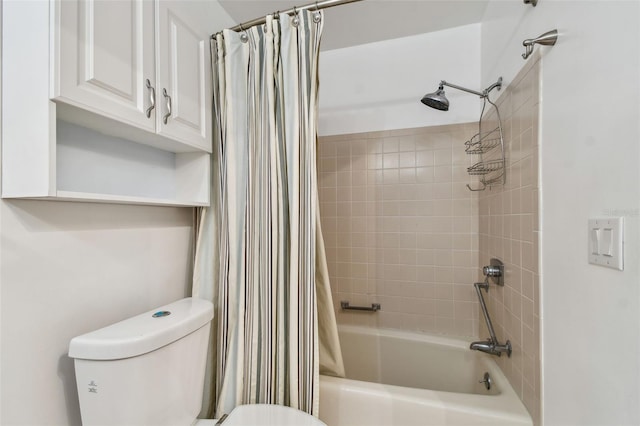 bathroom featuring shower / bath combo and toilet