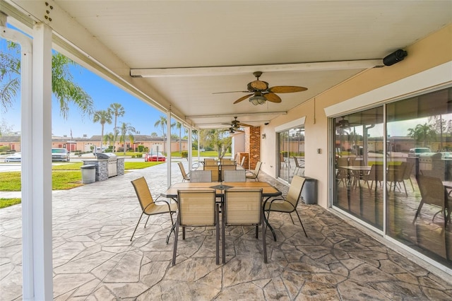 view of patio featuring a ceiling fan and outdoor dining space