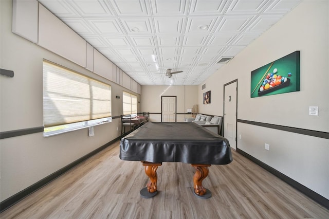 game room featuring billiards table, light wood finished floors, baseboards, ceiling fan, and an ornate ceiling