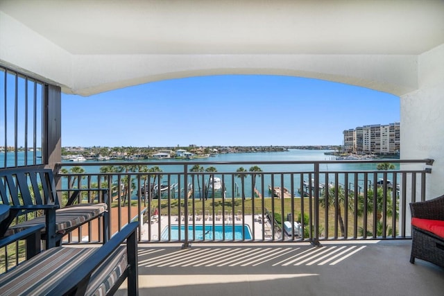 balcony featuring a water view