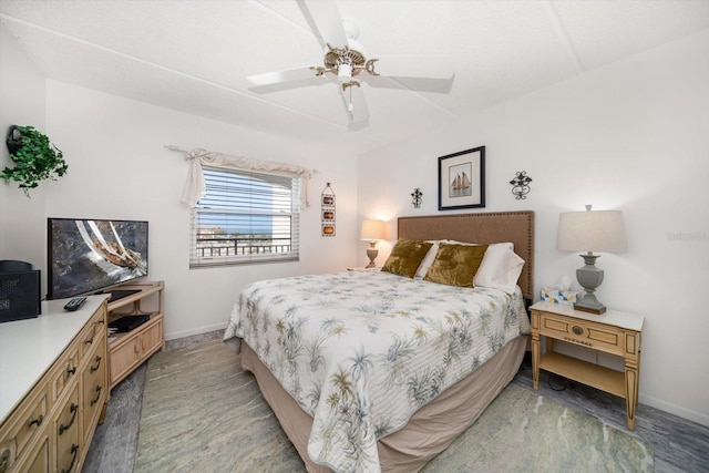bedroom featuring baseboards and a ceiling fan