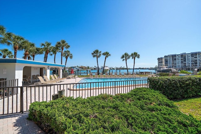 pool featuring a patio and fence