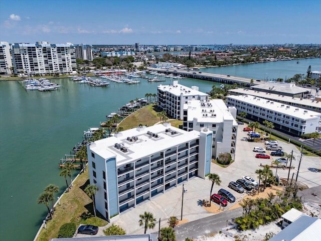 drone / aerial view featuring a water view and a view of city