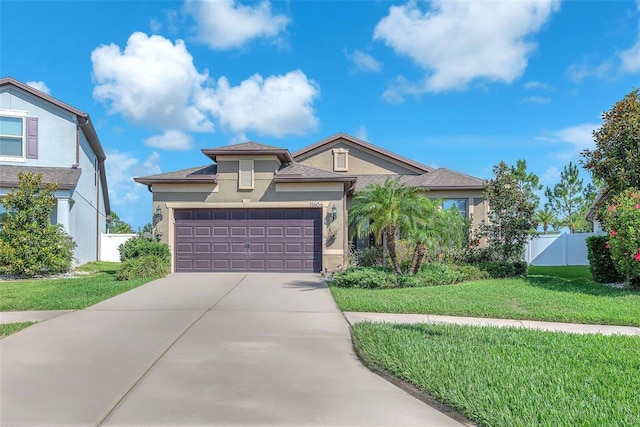 11606 Kilkenny Coral Dr, Riverview, FL 33579 - view of front facade with stucco siding, concrete driveway, and an attached garage