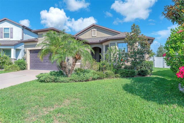 11606 Kilkenny Coral Dr, Riverview, FL 33579 - view of front of home with stucco siding and driveway