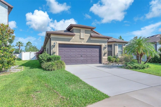 11606 Kilkenny Coral Dr, Riverview, FL 33579 - view of front of property featuring stucco siding, an attached garage, and driveway