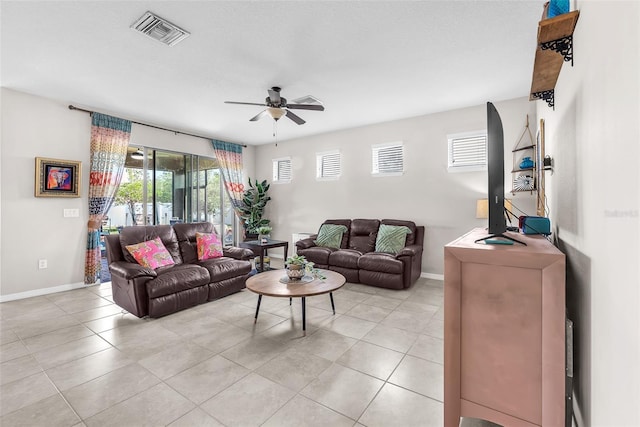 11606 Kilkenny Coral Dr, Riverview, FL 33579 - living room featuring a ceiling fan, baseboards, and light tile patterned floors