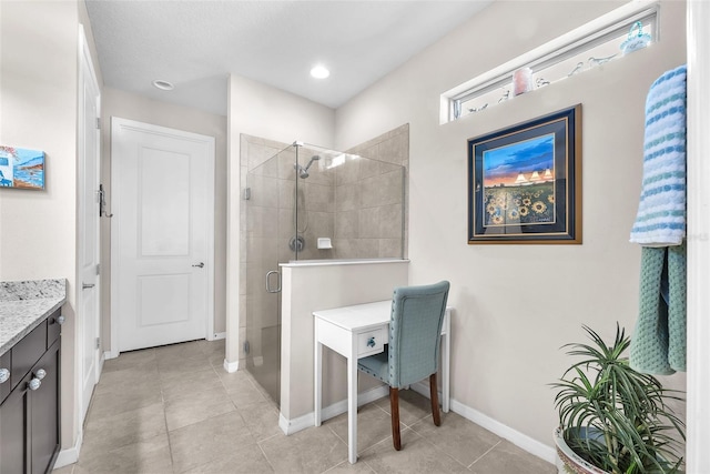 11606 Kilkenny Coral Dr, Riverview, FL 33579 - full bath featuring a shower stall, baseboards, vanity, and tile patterned flooring
