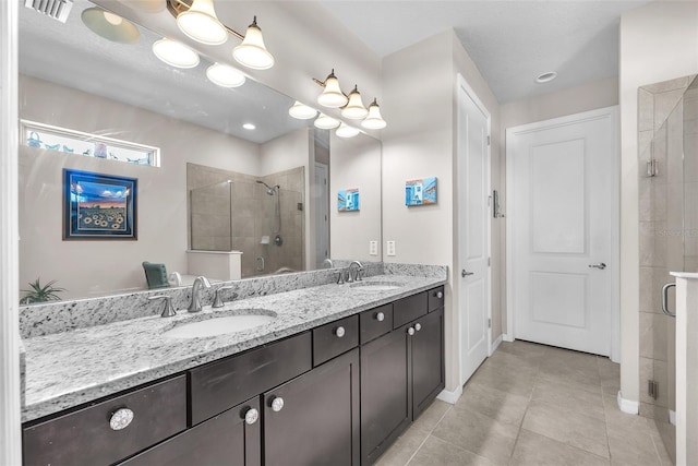 11606 Kilkenny Coral Dr, Riverview, FL 33579 - full bath featuring a stall shower, tile patterned flooring, double vanity, and baseboards