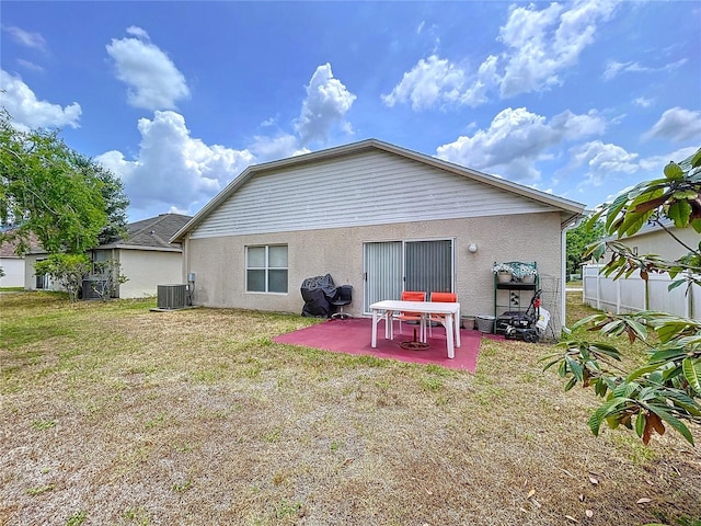 24305 Denali Ct, Lutz, FL 33559 - back of property featuring a patio, central AC, and stucco siding