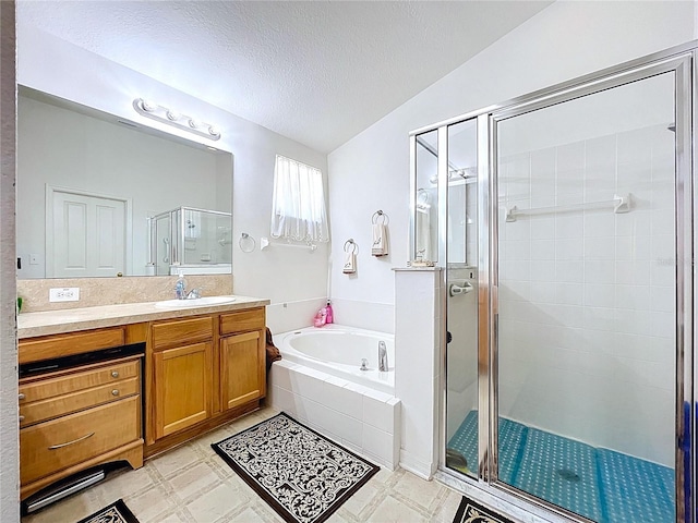 24305 Denali Ct, Lutz, FL 33559 - bathroom featuring a bath, a shower stall, vanity, and a textured ceiling