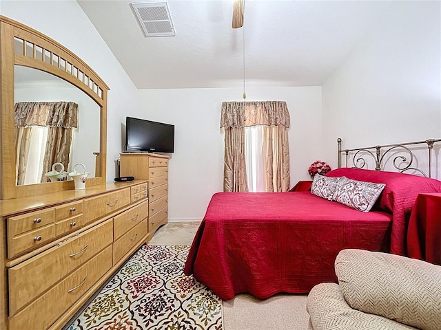 24305 Denali Ct, Lutz, FL 33559 - bedroom with light colored carpet, lofted ceiling, and a ceiling fan
