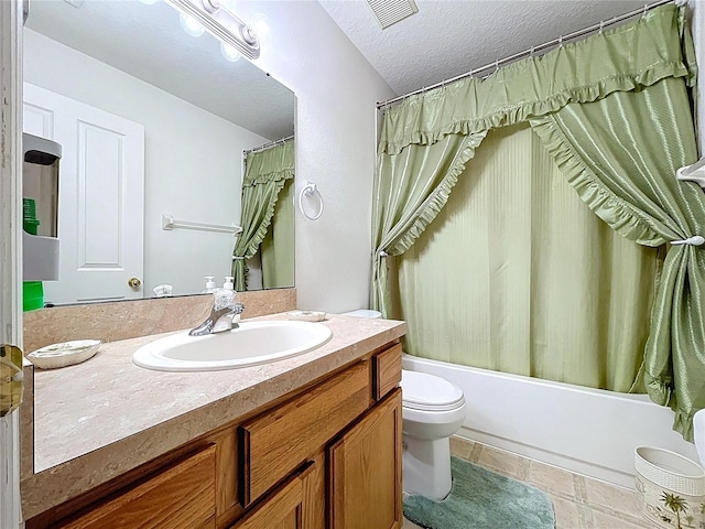 24305 Denali Ct, Lutz, FL 33559 - full bath with vanity, toilet, shower / tub combo with curtain, and a textured ceiling