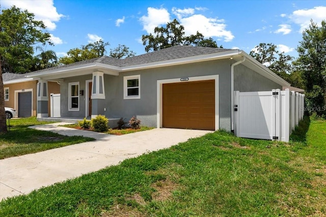2906 E Columbus Dr, Tampa, FL 33605 - view of front of house featuring concrete driveway, stucco siding, a front lawn, and an attached garage