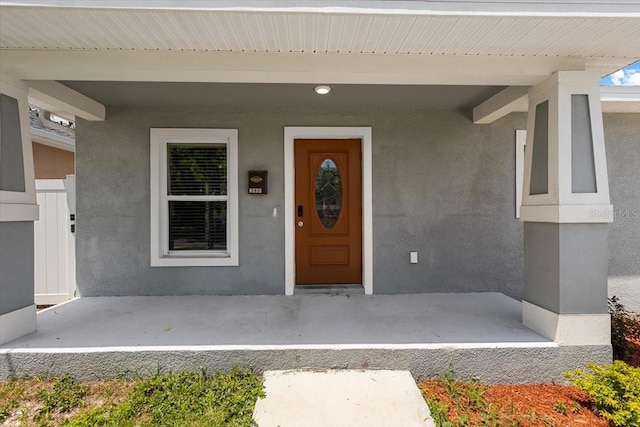 2906 E Columbus Dr, Tampa, FL 33605 - property entrance featuring stucco siding and a porch