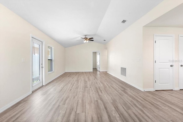 2906 E Columbus Dr, Tampa, FL 33605 - unfurnished living room with vaulted ceiling, visible vents, light wood-style flooring, and ceiling fan