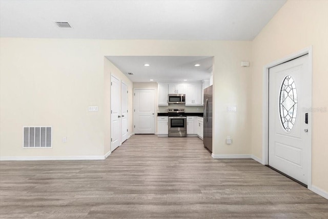 2906 E Columbus Dr, Tampa, FL 33605 - foyer entrance with light wood-type flooring, recessed lighting, baseboards, and visible vents