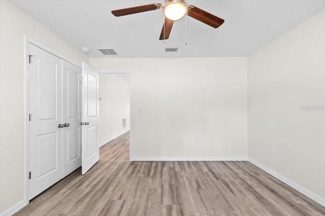 2906 E Columbus Dr, Tampa, FL 33605 - unfurnished bedroom featuring baseboards, a closet, visible vents, and wood finished floors