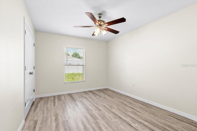 2906 E Columbus Dr, Tampa, FL 33605 - spare room with light wood-style floors, baseboards, and ceiling fan