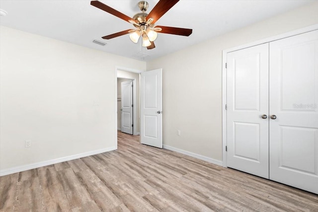 2906 E Columbus Dr, Tampa, FL 33605 - unfurnished bedroom featuring baseboards, visible vents, and wood finished floors