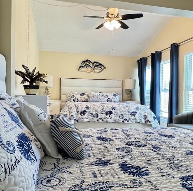 323 Rex Pl Unit G, Madeira Beach, FL 33708 - bedroom featuring vaulted ceiling and ceiling fan