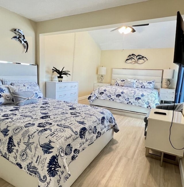 323 Rex Pl Unit G, Madeira Beach, FL 33708 - bedroom featuring light wood-style flooring and a ceiling fan