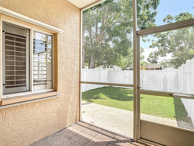 unfurnished sunroom featuring a healthy amount of sunlight