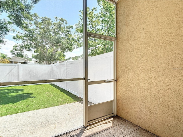 unfurnished sunroom with a wealth of natural light