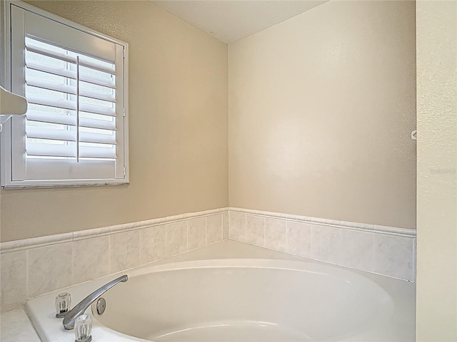 bathroom featuring a bath